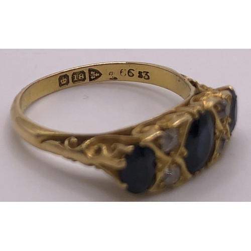 670 - An 18ct gold, sapphire and diamond ring, ring size S