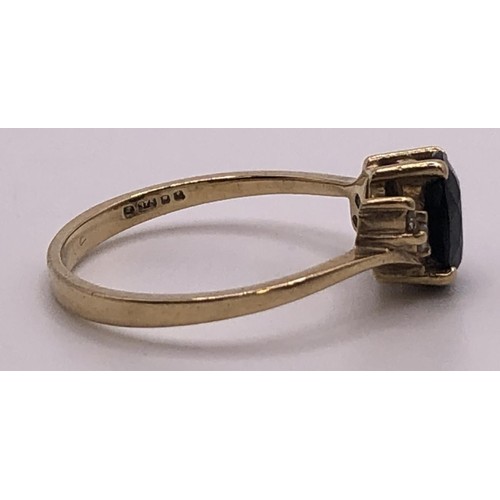 674 - A 9ct gold, sapphire and diamond ring, ring size O