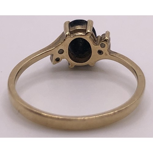 674 - A 9ct gold, sapphire and diamond ring, ring size O