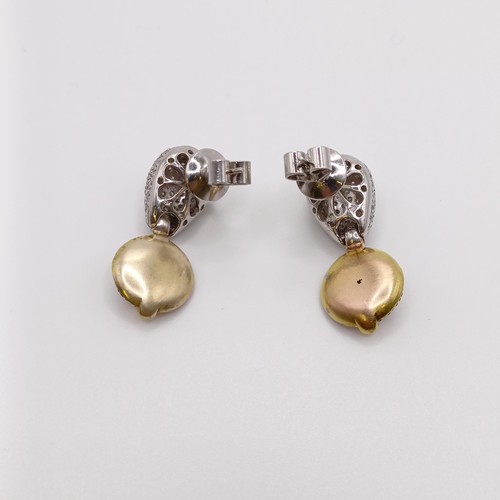 677 - A pair of 18ct gold, diamond and coloured stone earrings