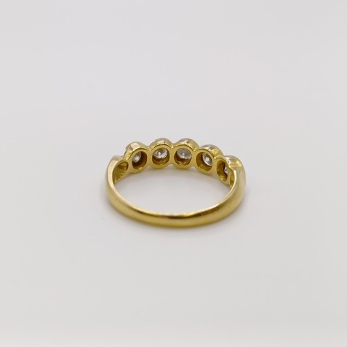 682 - An 18ct gold and diamond five stone ring, ring size M