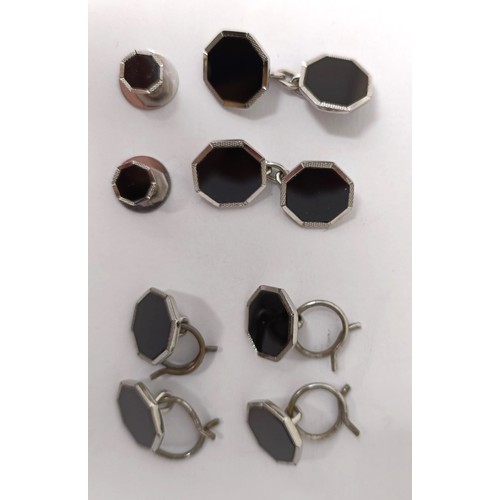 716 - An Asprey silver coloured metal and black enamel button set, cased