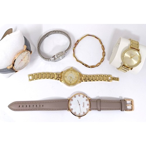 718 - A ladies gold plated Diamonique wristwatch and matching bracelet, and four other dress watches