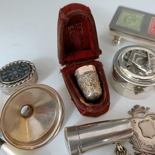 58 - A group of silver medallions, a silver cheroot case, and other items