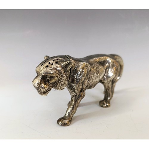 62 - A silver coloured metal pepperette, in the form of a large walking cat, 13.5 cm long