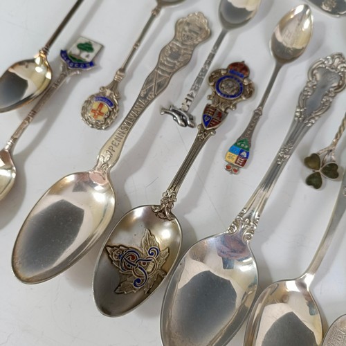 74 - Assorted silver coloured metal and other travel/commemorative spoons, some with enamel decoration