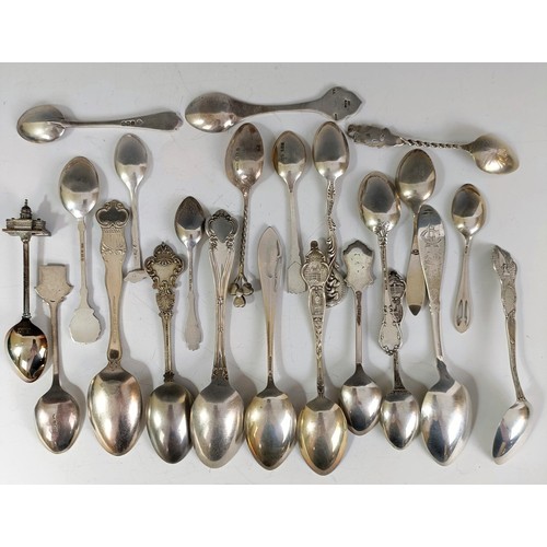 74 - Assorted silver coloured metal and other travel/commemorative spoons, some with enamel decoration