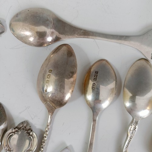 74 - Assorted silver coloured metal and other travel/commemorative spoons, some with enamel decoration