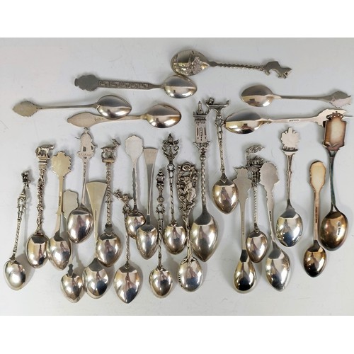 75 - Assorted silver coloured metal and other travel/commemorative spoons, some with enamel decoration