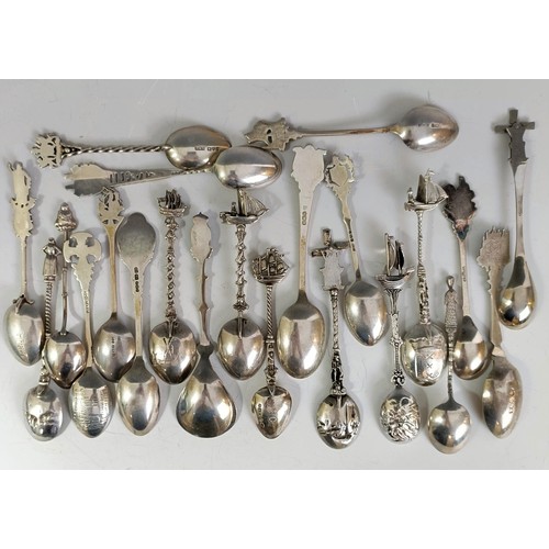 76 - A group of silver and silver coloured metal souvenir spoons