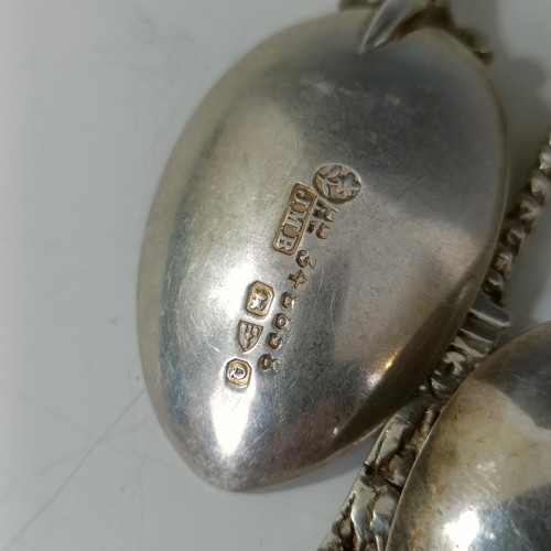 76 - A group of silver and silver coloured metal souvenir spoons