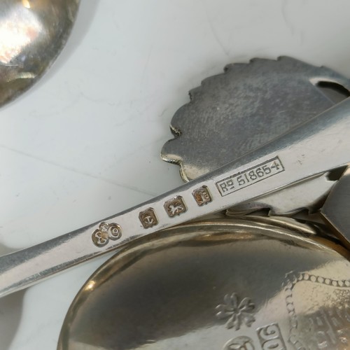 77 - Assorted silver coloured metal and other travel/commemorative spoons, some with enamel decoration