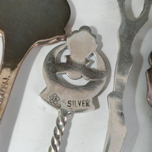 77 - Assorted silver coloured metal and other travel/commemorative spoons, some with enamel decoration