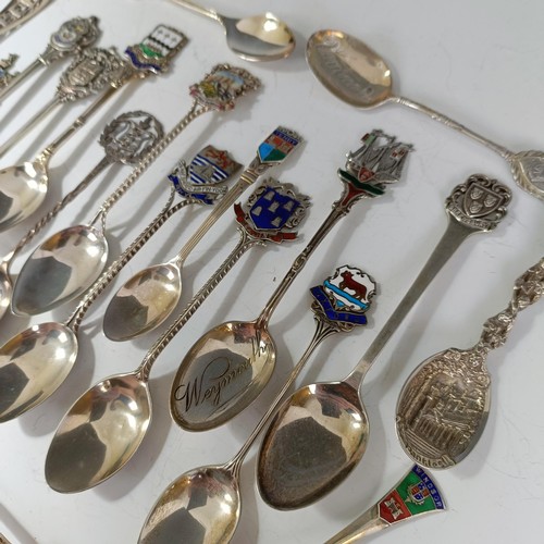 78 - Assorted silver coloured metal and other travel/commemorative spoons, some with enamel decoration