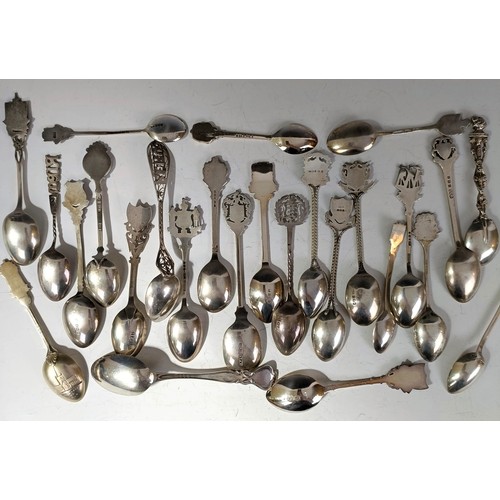 78 - Assorted silver coloured metal and other travel/commemorative spoons, some with enamel decoration