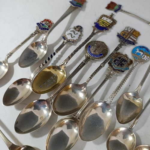 79 - A group of silver and enamel souvenir spoons