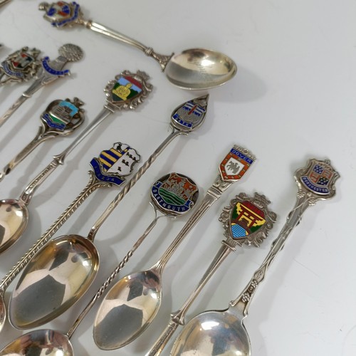 79 - A group of silver and enamel souvenir spoons