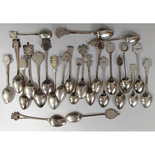 79 - A group of silver and enamel souvenir spoons