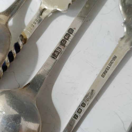 79 - A group of silver and enamel souvenir spoons