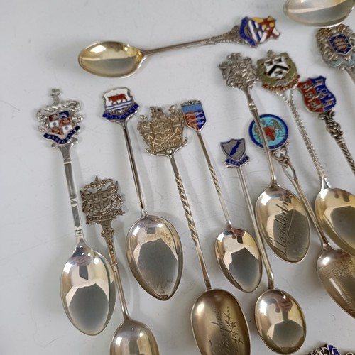 80 - Assorted silver coloured metal and other travel/commemorative spoons, some with enamel decoration