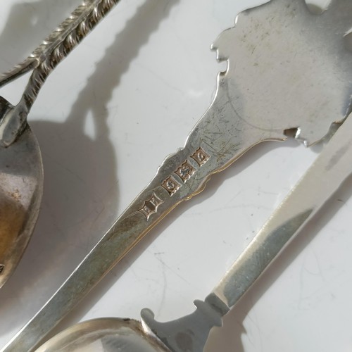 80 - Assorted silver coloured metal and other travel/commemorative spoons, some with enamel decoration