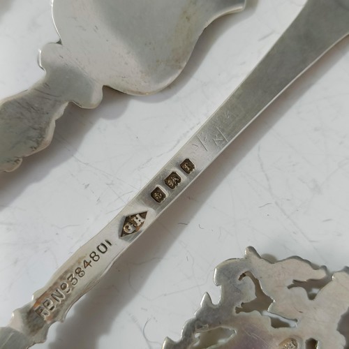 80 - Assorted silver coloured metal and other travel/commemorative spoons, some with enamel decoration