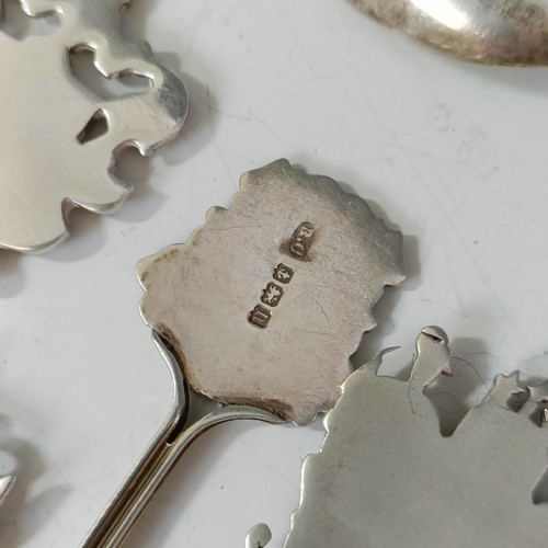 80 - Assorted silver coloured metal and other travel/commemorative spoons, some with enamel decoration