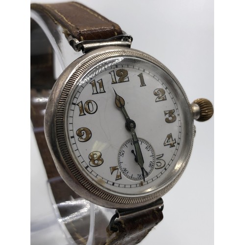 762 - A 1920s gentleman's silver wristwatch, with a later leather strap