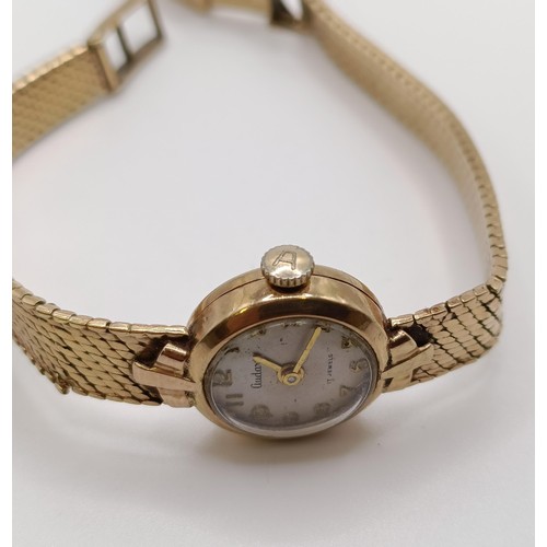 763 - A ladies 9ct gold Audax wristwatch, all in 19.3 g