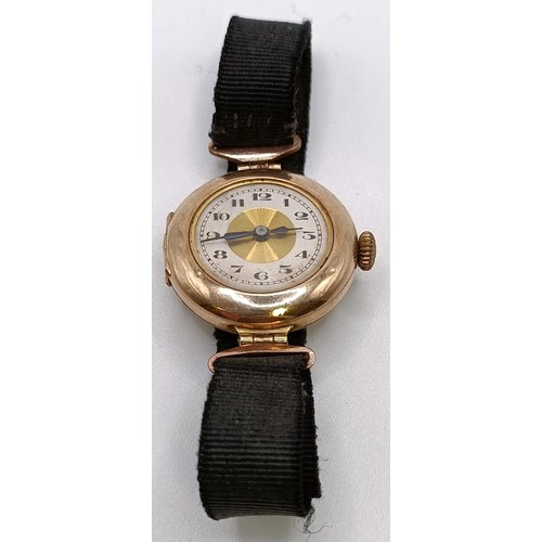 768 - A ladies 9ct gold wristwatch, on a silk strap