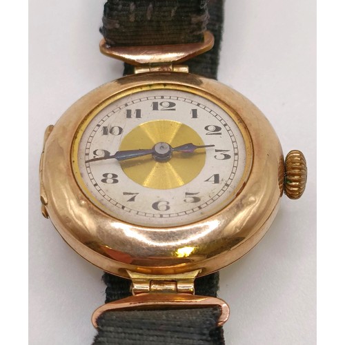 768 - A ladies 9ct gold wristwatch, on a silk strap