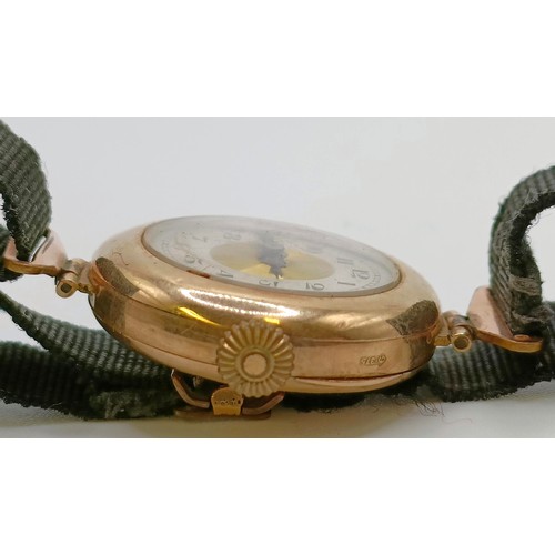 768 - A ladies 9ct gold wristwatch, on a silk strap