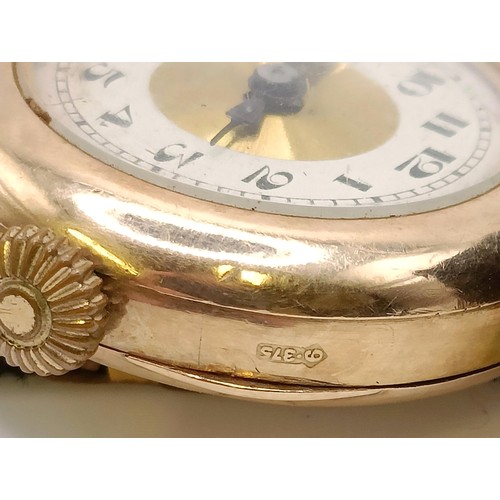 768 - A ladies 9ct gold wristwatch, on a silk strap