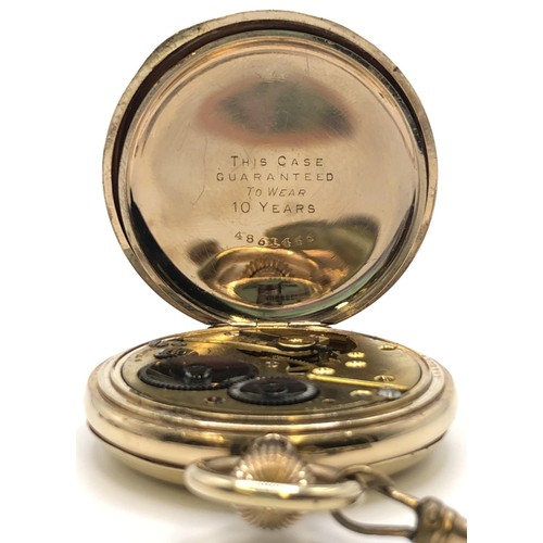 777 - A gold plated full hunter pocket watch, with a gold plated Albert