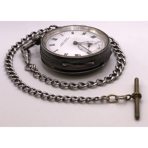 785 - A silver open face pocket watch, and a silver Albert, with a brass T bar