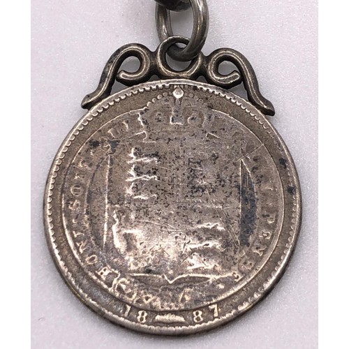 789 - A silver plated open face pocket watch, with a silver Albert and charm