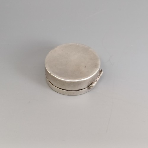 305 - A small circular silver pill box