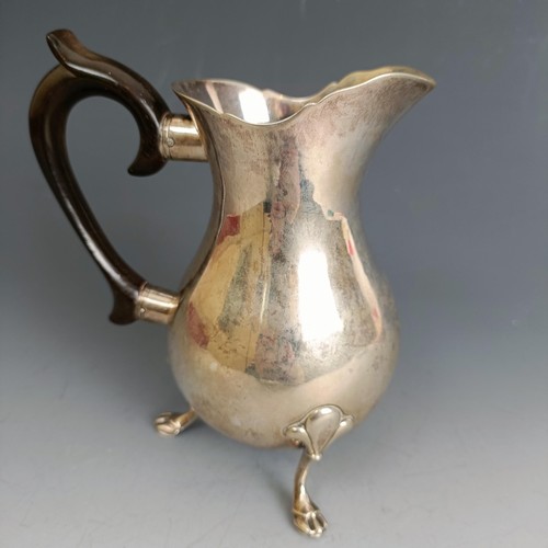 330 - An 18th century style Continental silver coloured metal jug, on three pad feet, 13 cm high