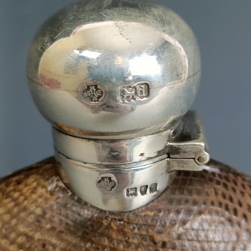 335 - A late Victorian silver, glass and leather flask, of oval form, marks rubbed, London 1899, 16 cm