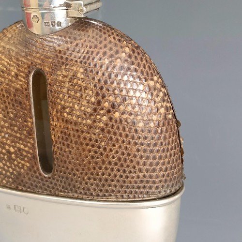 335 - A late Victorian silver, glass and leather flask, of oval form, marks rubbed, London 1899, 16 cm