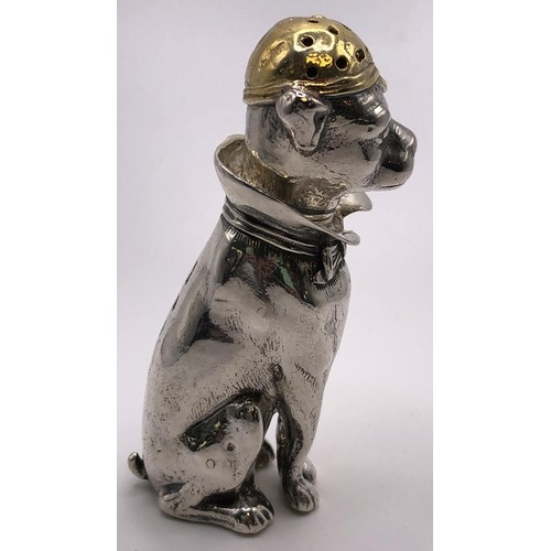 161 - A modern silver and silver gilt pepperette, in the form of a seated dog, wearing a cap, London 2001,... 