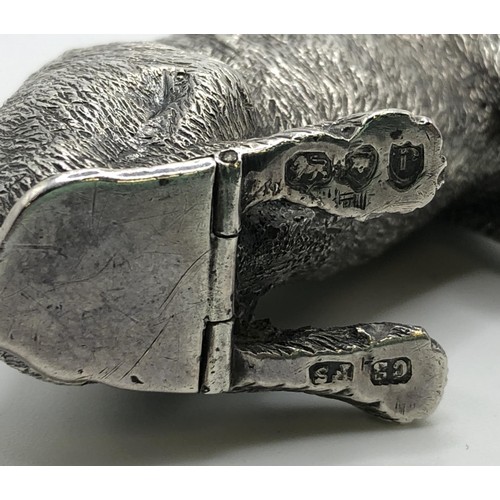 151 - A late Victorian silver vesta case, in the form of a seated dog, London 1890, 1.7 ozt, 6.5 cm high