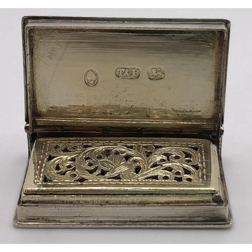 136 - A William IV silver vinaigrette, in the form of a book, with engine turned decoration, initialled, T... 