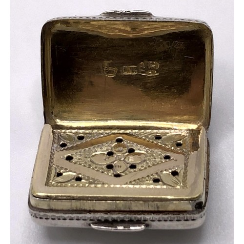 136 - A William IV silver vinaigrette, in the form of a book, with engine turned decoration, initialled, T... 