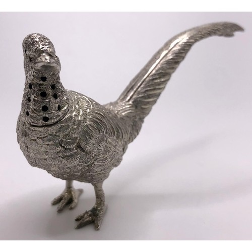 133 - A pair of silver pepperettes, in the form of a cock and a hen pheasant, London 1924, 3.1 ozt, the co... 