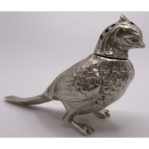 133 - A pair of silver pepperettes, in the form of a cock and a hen pheasant, London 1924, 3.1 ozt, the co... 