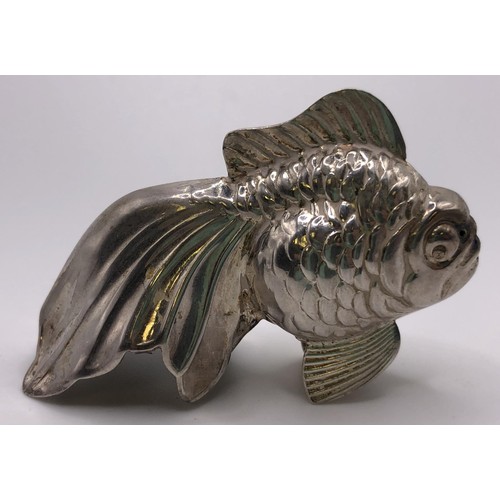 132 - A pair of silver coloured metal pepperettes, in the form of fish, 4 cm high, and a modern silver pin... 