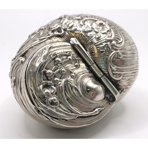 131 - A late Victorian silver snuff box, in the form of a shell, Birmingham 1889, 2.5 cm high, and a moder... 