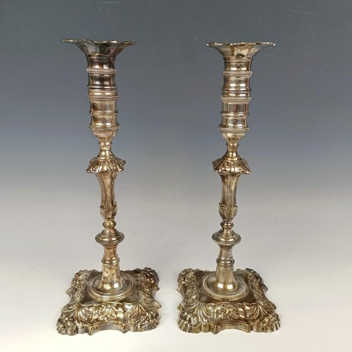 1 - A pair of late Victorian cast silver candlesticks, with knopped stems, on shaped bases, London 1899,... 