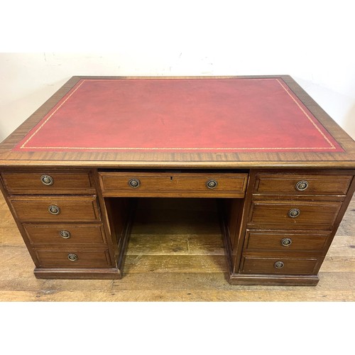 1243 - A 20th century partners mahogany desk, 157 cm wide